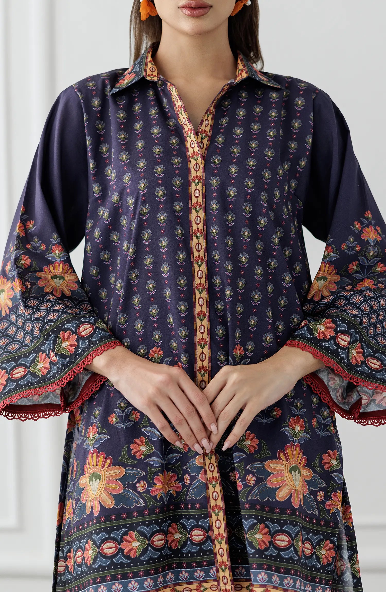 Women wearing a Navy blue patterned shirt and pants set. Stitched Printed Lawn Shirt & Pant - 2 Piece Suits (Co-ord Set) - WRCV25S-2006