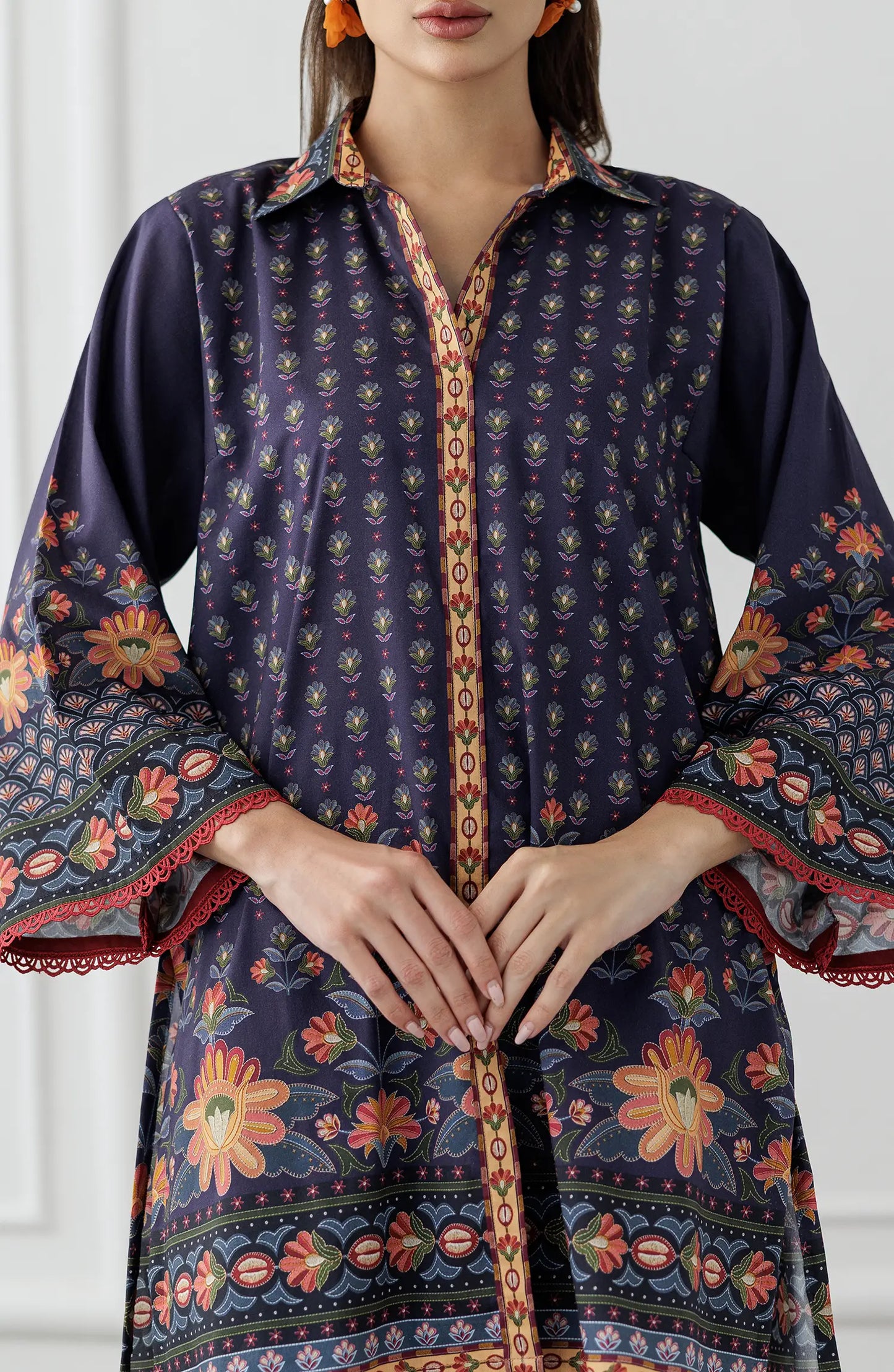 Women wearing a Navy blue patterned shirt and pants set. Stitched Printed Lawn Shirt & Pant - 2 Piece Suits (Co-ord Set) - WRCV25S-2006