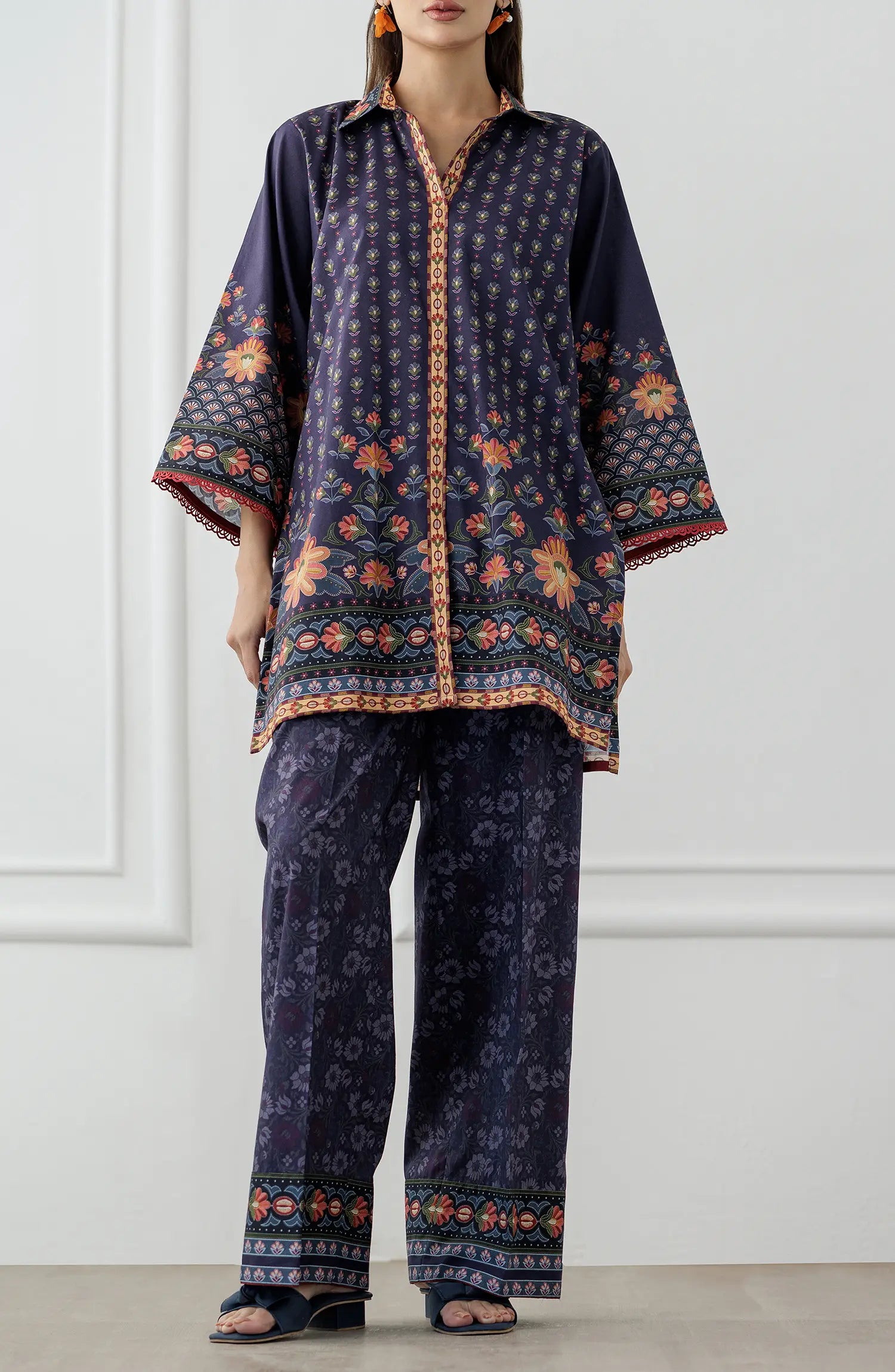 Women wearing a Navy blue patterned shirt and pants set. Stitched Printed Lawn Shirt & Pant - 2 Piece Suits (Co-ord Set) - WRCV25S-2006