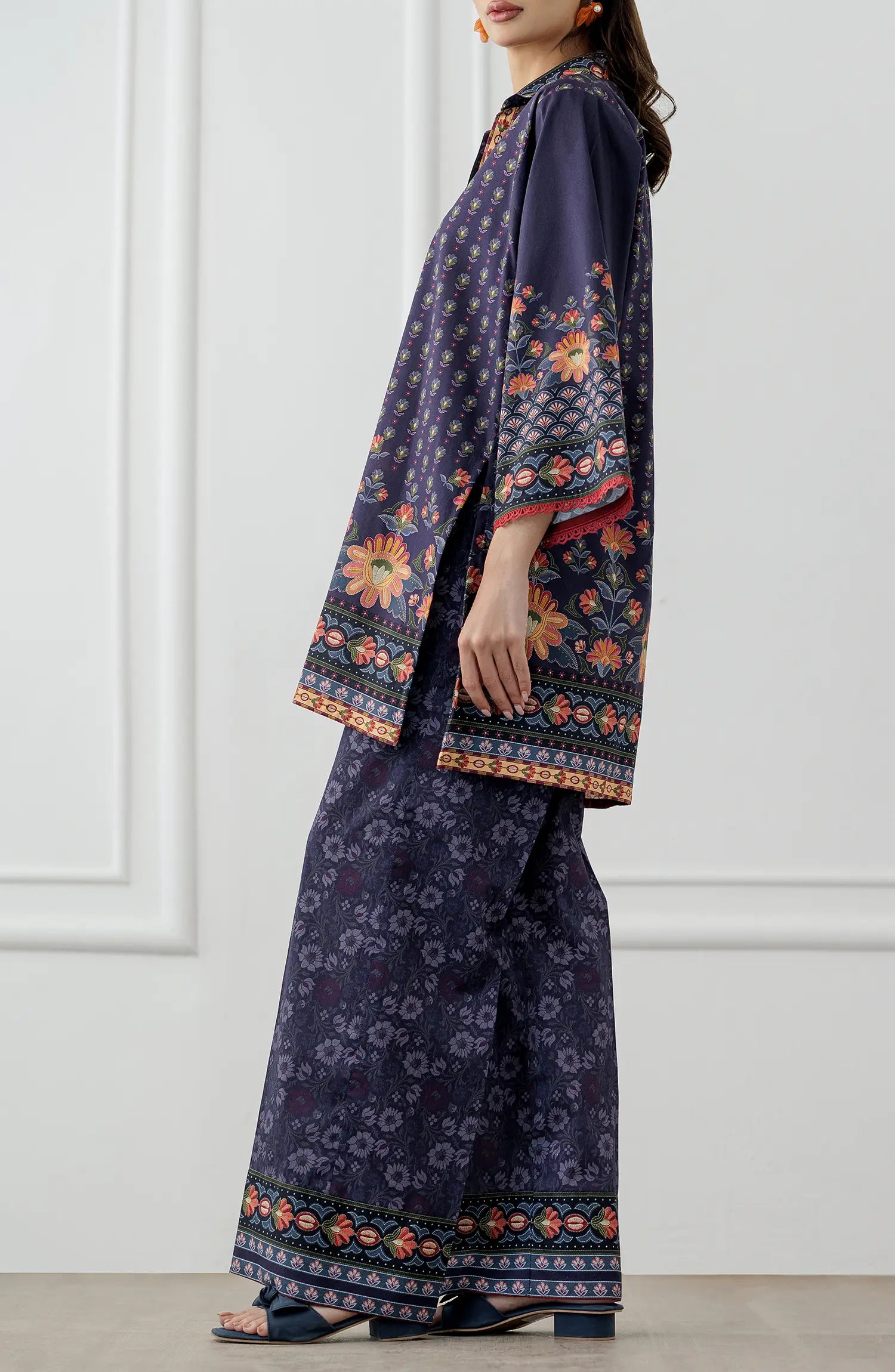 Women wearing a Navy blue patterned shirt and pants set. Stitched Printed Lawn Shirt & Pant - 2 Piece Suits (Co-ord Set) - WRCV25S-2006