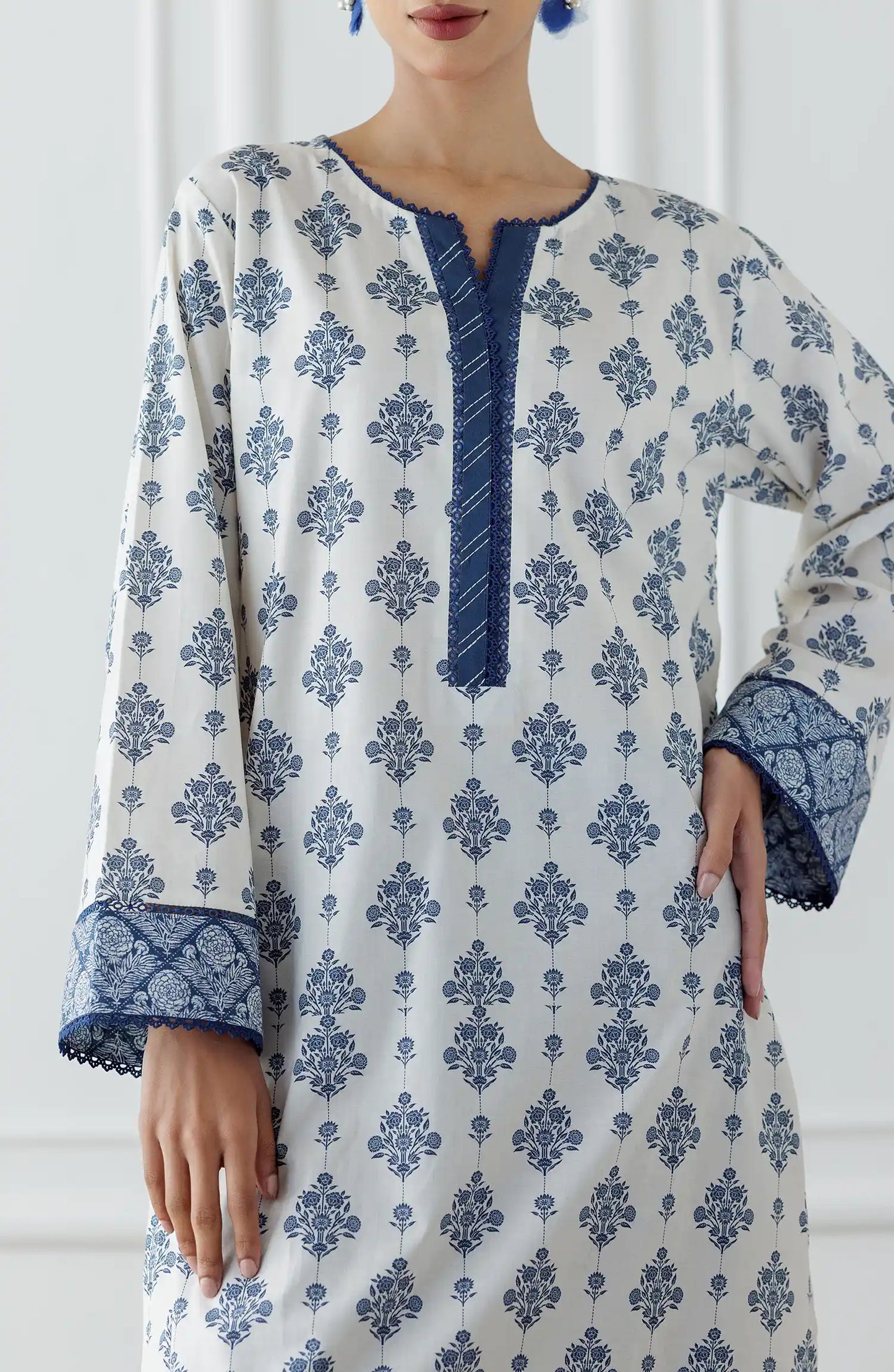 Women wearing a blue and white patterned kurta with matching pants. Stitched Printed Lawn Shirt & Pant - 2 Piece (Co-ord Set) - WRCV25S-2011