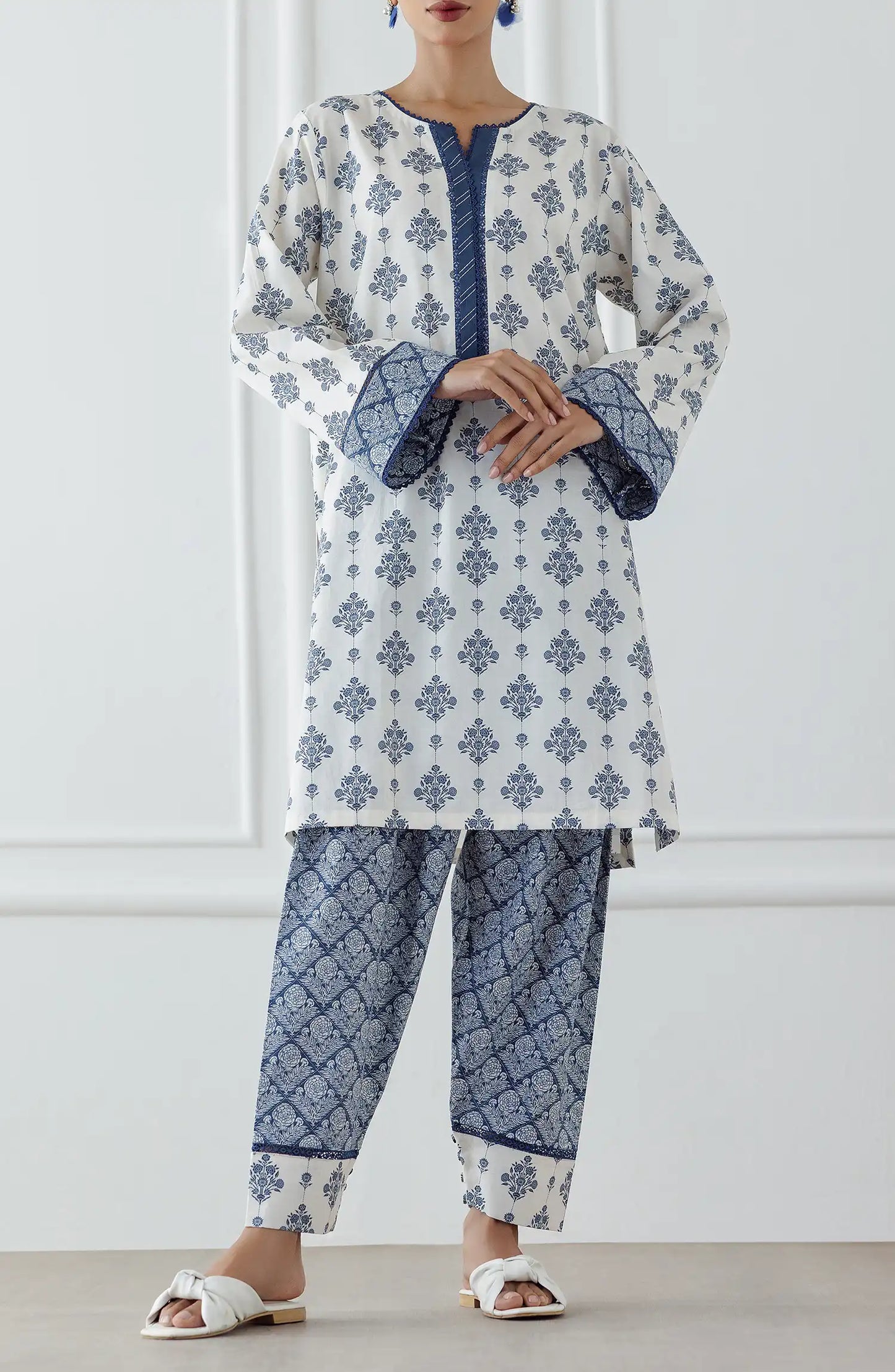 Women wearing a blue and white patterned kurta with matching pants. Stitched Printed Lawn Shirt & Pant - 2 Piece (Co-ord Set) - WRCV25S-2011