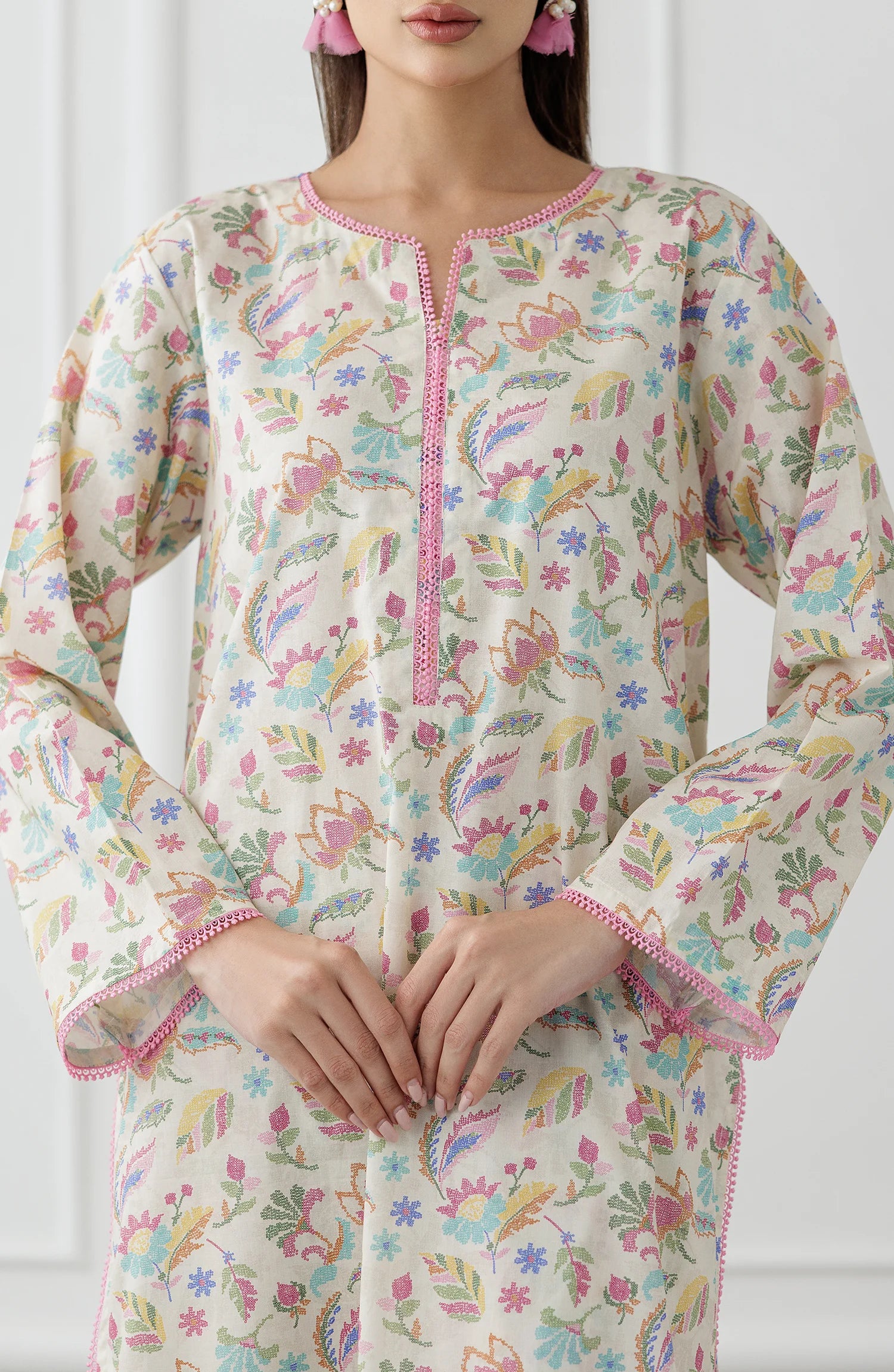 Woman wearing a floral kurta with matching pants. Stitched Printed Lawn Shirt & Pant - 2 Piece Suits (Co-ord Set) - WRCV25S-2024
