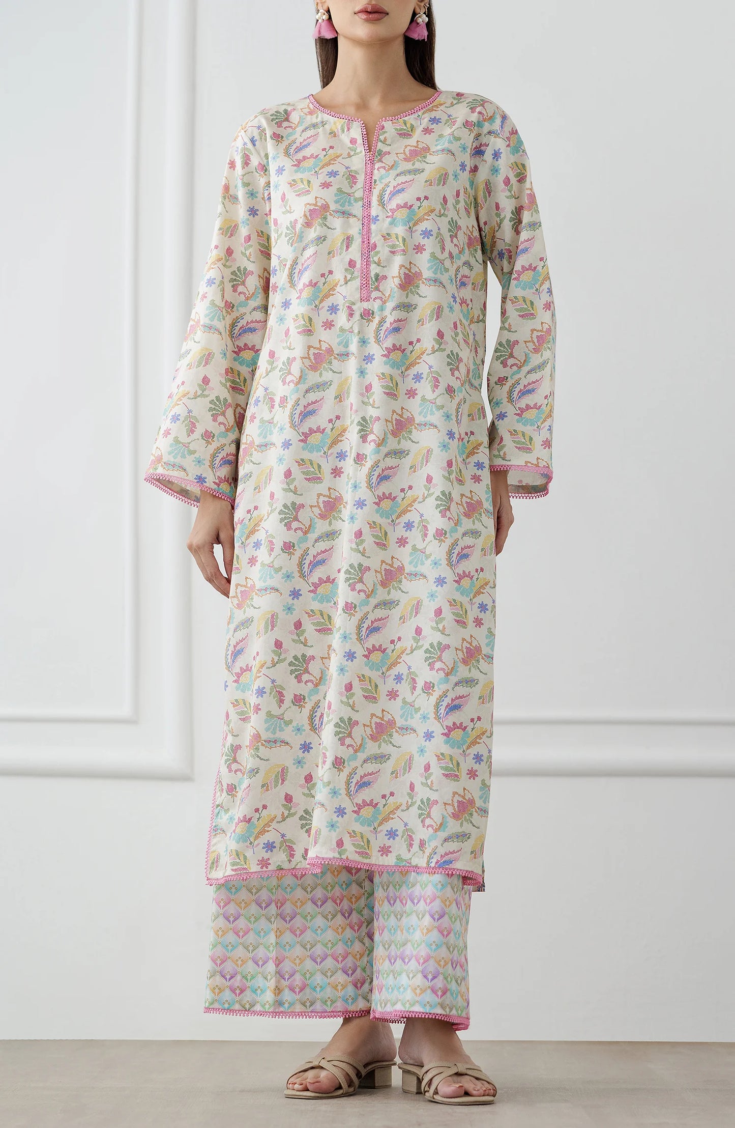 Woman wearing a floral kurta with matching pants. Stitched Printed Lawn Shirt & Pant - 2 Piece Suits (Co-ord Set) - WRCV25S-2024