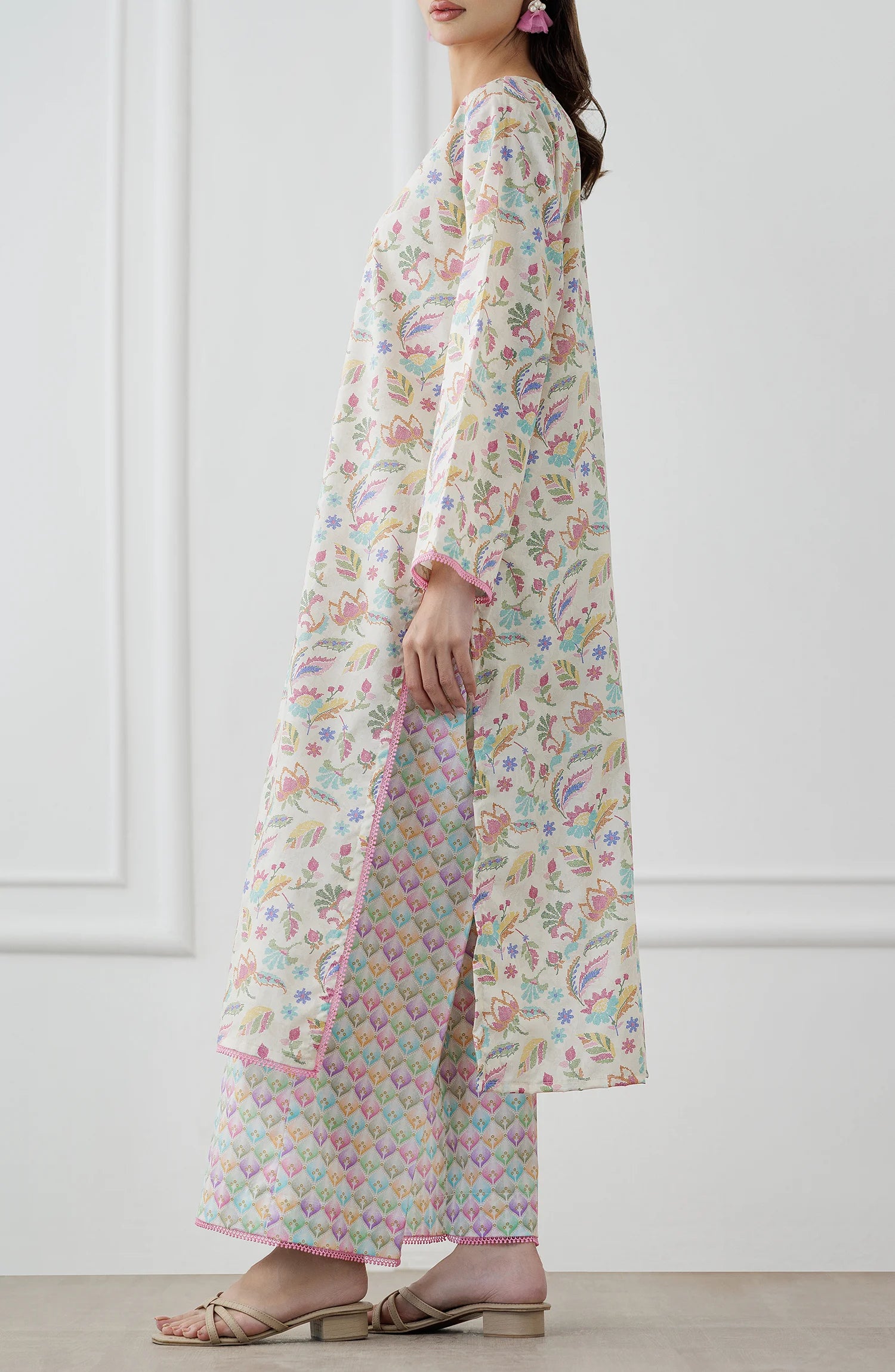 Woman wearing a floral kurta with matching pants. Stitched Printed Lawn Shirt & Pant - 2 Piece Suits (Co-ord Set) - WRCV25S-2024