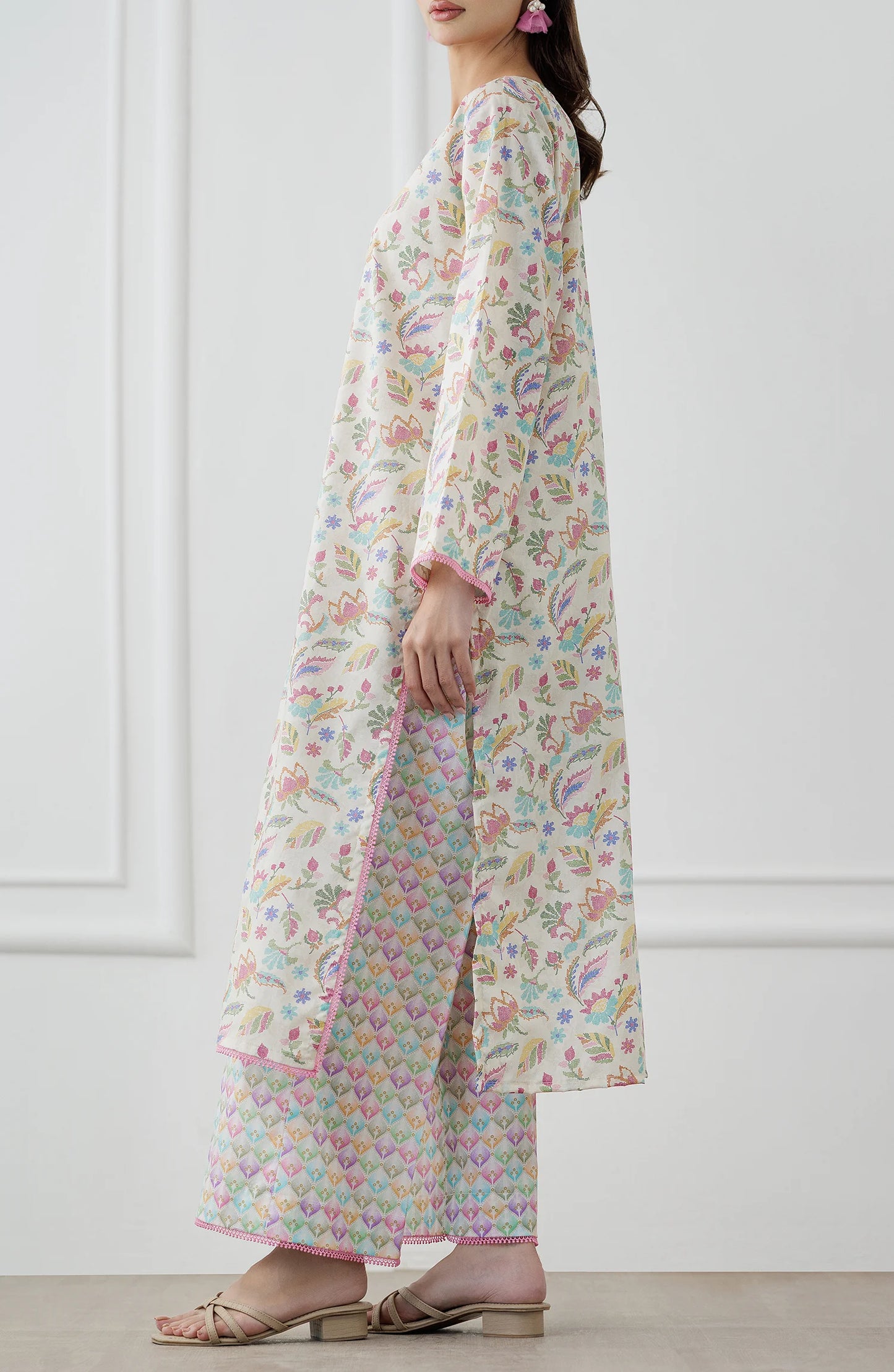 Woman wearing a floral kurta with matching pants. Stitched Printed Lawn Shirt & Pant - 2 Piece Suits (Co-ord Set) - WRCV25S-2024