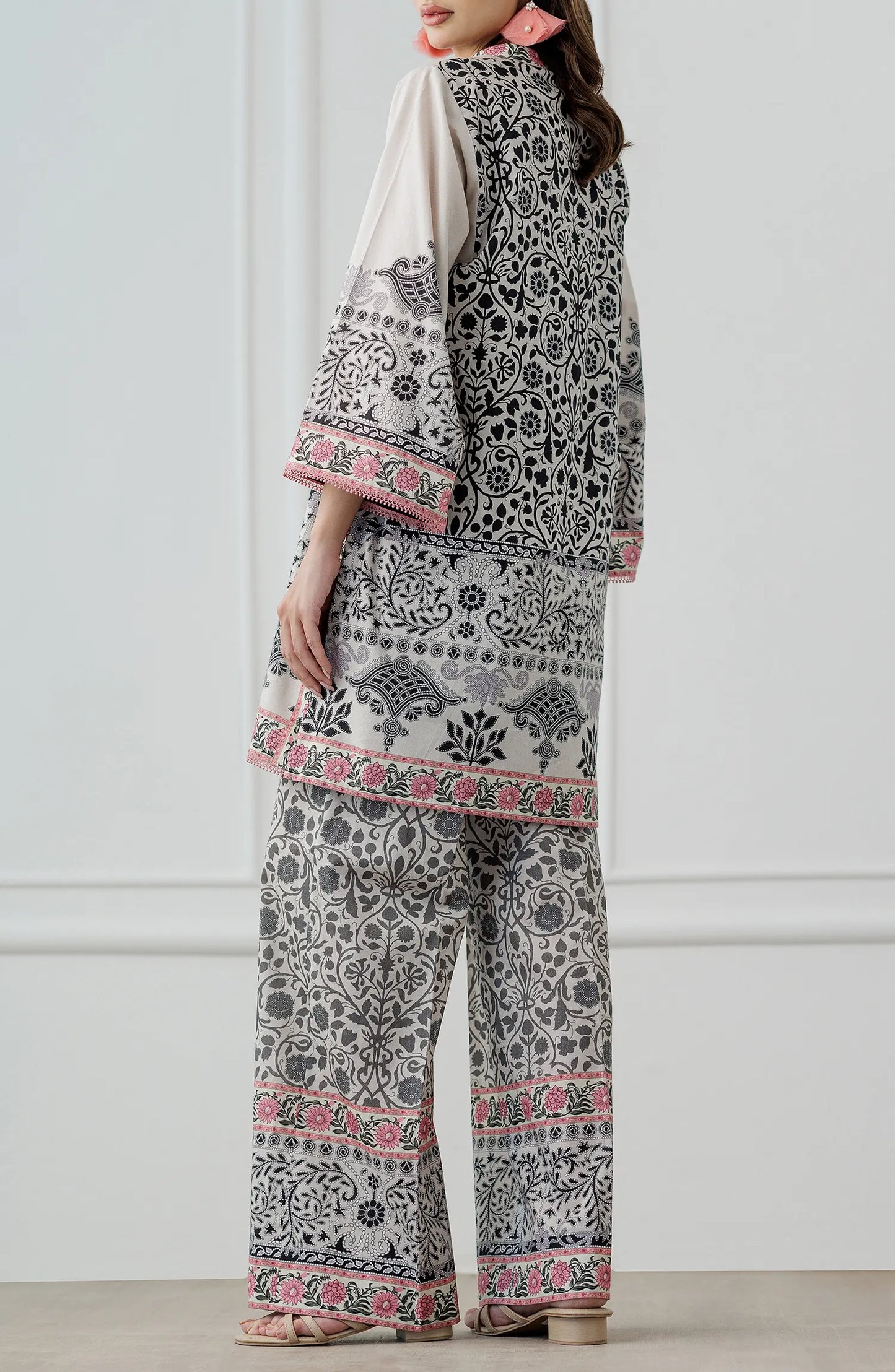 Women wearing a patterned white outfit with matching trouser. Stitched Printed Lawn Shirt & Pant - 2 Piece Suits (Co-ord Set) - WRCV25S-2028