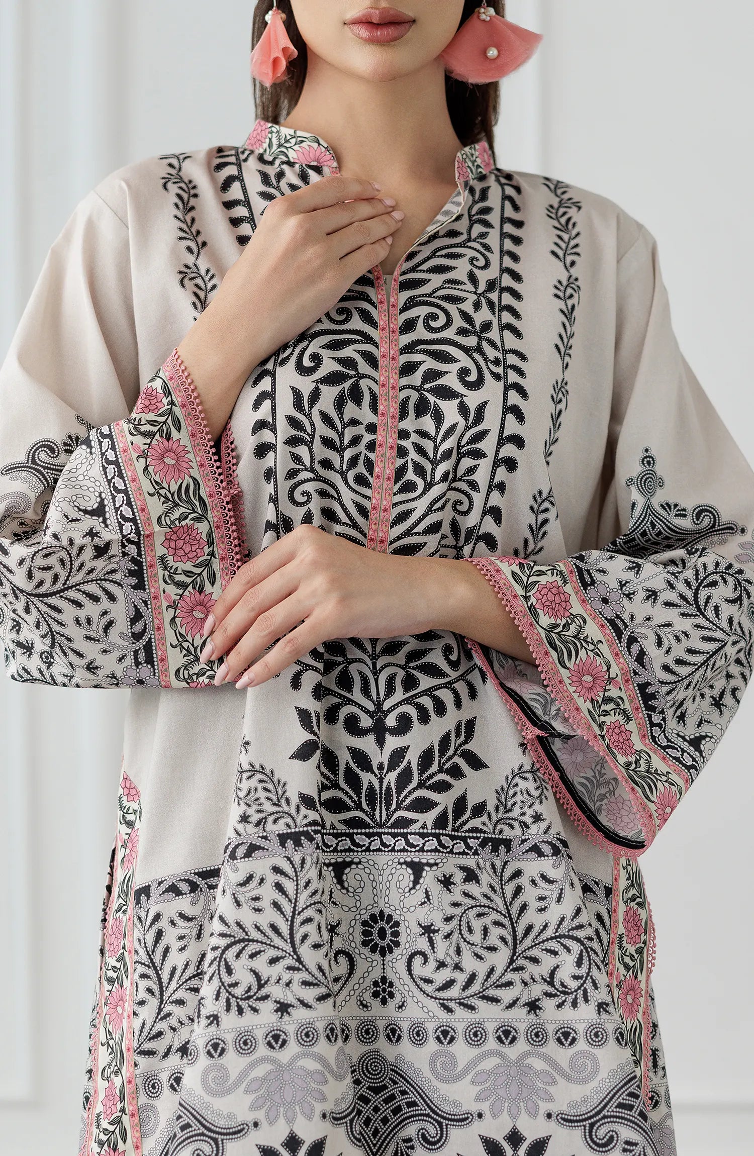 Women wearing a patterned white outfit with matching trouser. Stitched Printed Lawn Shirt & Pant - 2 Piece Suits (Co-ord Set) - WRCV25S-2028