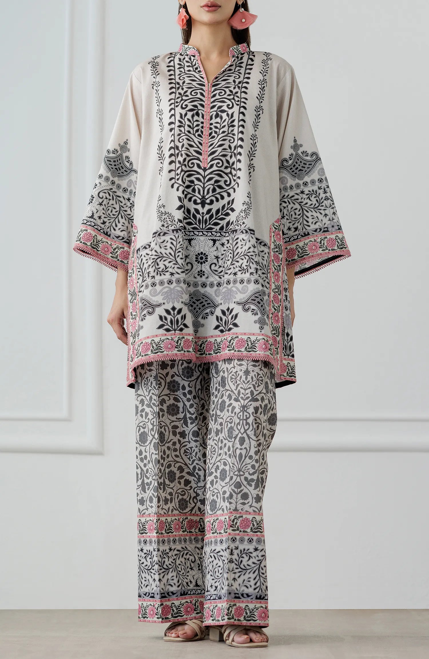 Women wearing a patterned white outfit with matching trouser. Stitched Printed Lawn Shirt & Pant - 2 Piece Suits (Co-ord Set) - WRCV25S-2028