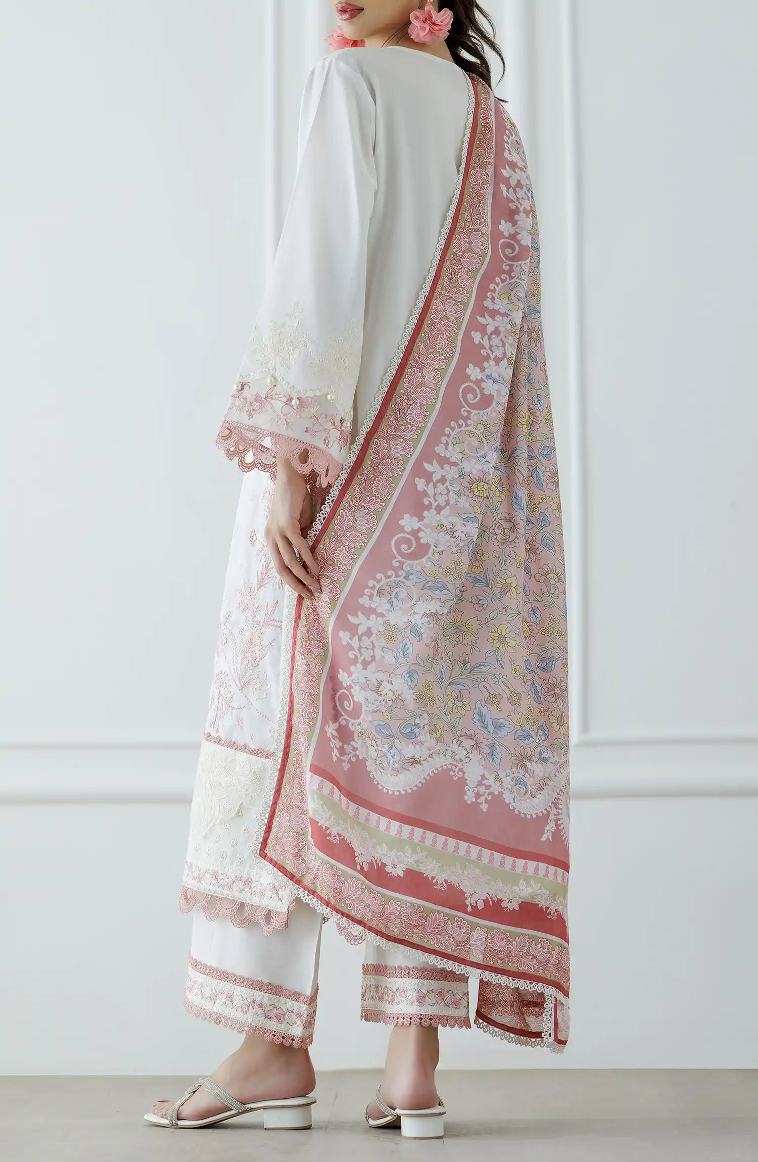 Woman wearing a white and pink embroidered traditional outfit with a matching dupatta against a dyed trouser. Stitched Luxury Festive Formal Lawn Shirt Dupatta & Pant - 3 Piece Suits - WRFC25S-3030