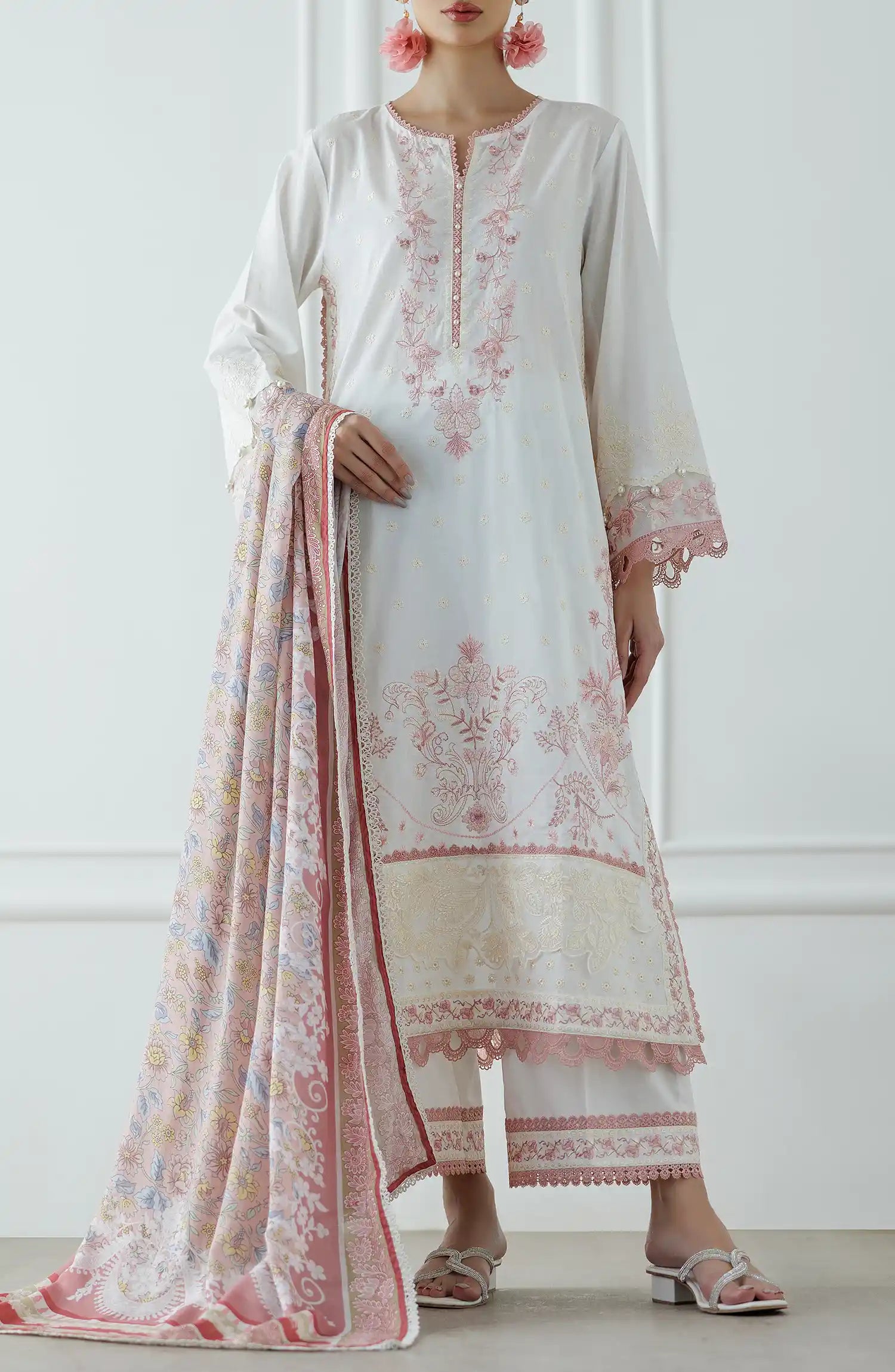 Woman wearing a white and pink embroidered traditional outfit with a matching dupatta against a dyed trouser. Stitched Luxury Festive Formal Lawn Shirt Dupatta & Pant - 3 Piece Suits - WRFC25S-3030