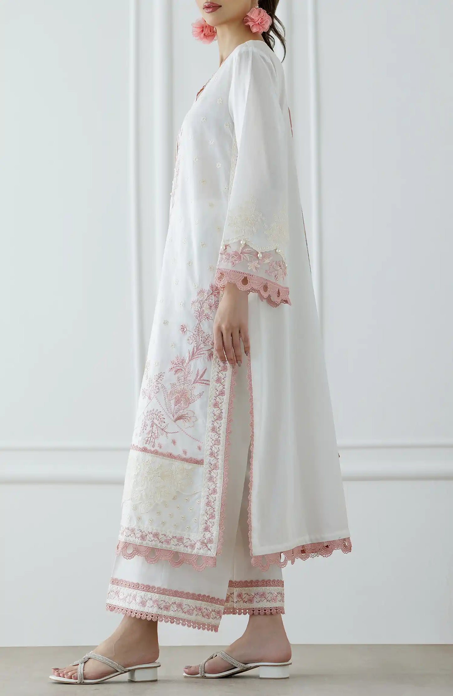 Woman wearing a white and pink embroidered traditional outfit with a matching dupatta against a dyed trouser. Stitched Luxury Festive Formal Lawn Shirt Dupatta & Pant - 3 Piece Suits - WRFC25S-3030