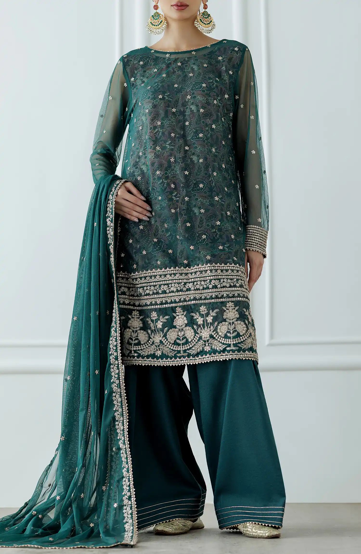 Women wearing a embroidered Teal traditional outfit with intricate embroidery on a farshi shalwar. Stitched Luxury Festive Formal Poly Net Shirt Dupatta & Pant - 3 Piece Suits - WRFP24W-3001