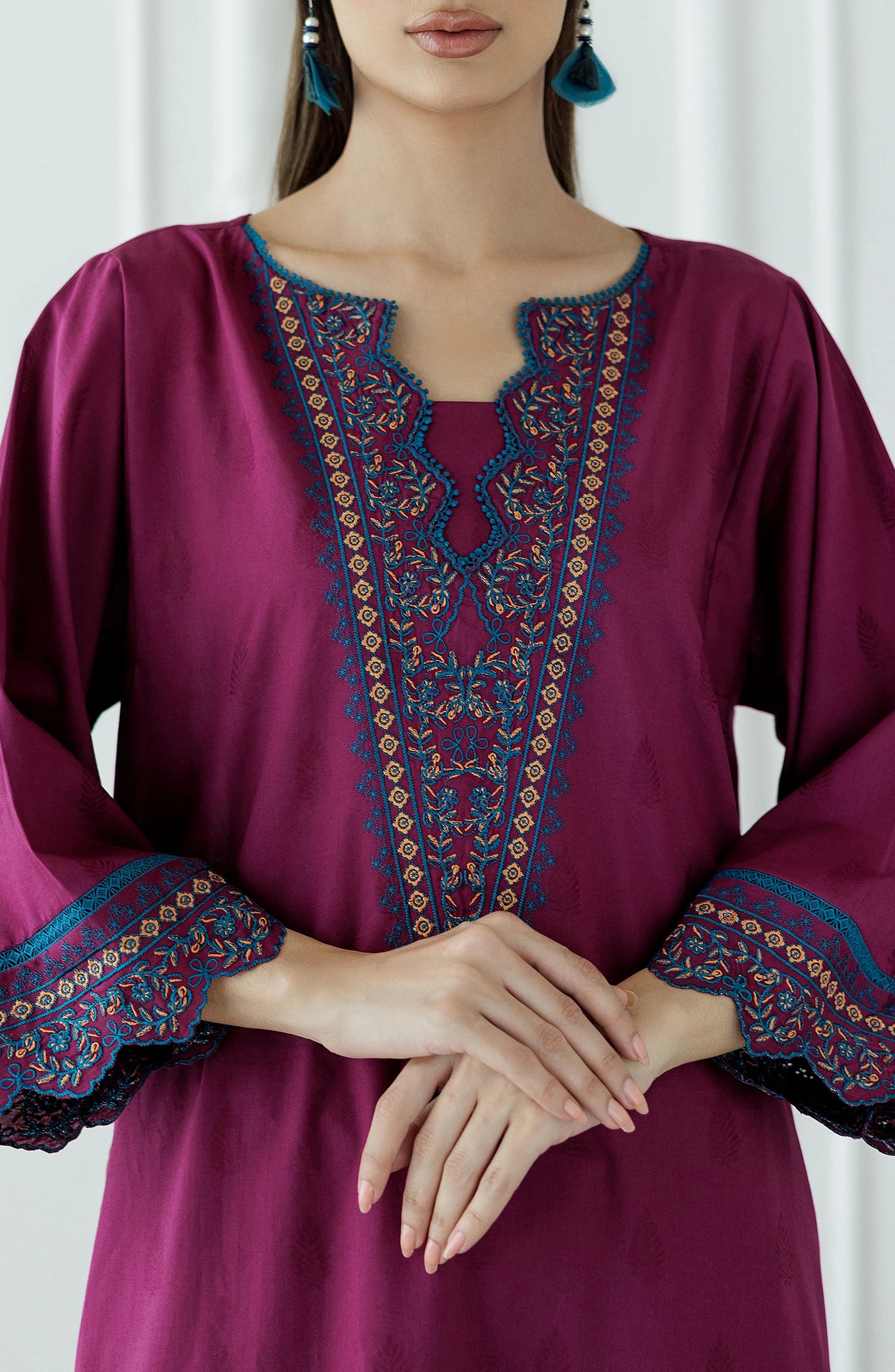 Woman wearing a magenta embroidered outfit with a lace detail dyed trouser. Stitched Luxury Premium Embroidered Lawn Shirt & Pant - 2 Piece Suits (Co-ord Set) - WRHC24S-2011