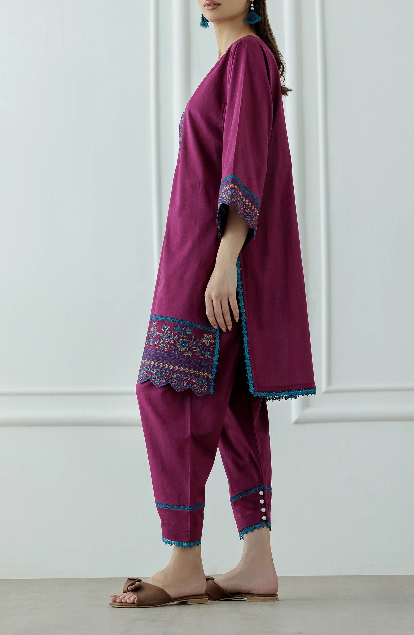 Woman wearing a magenta embroidered outfit with a lace detail dyed trouser. Stitched Luxury Premium Embroidered Lawn Shirt & Pant - 2 Piece Suits (Co-ord Set) - WRHC24S-2011