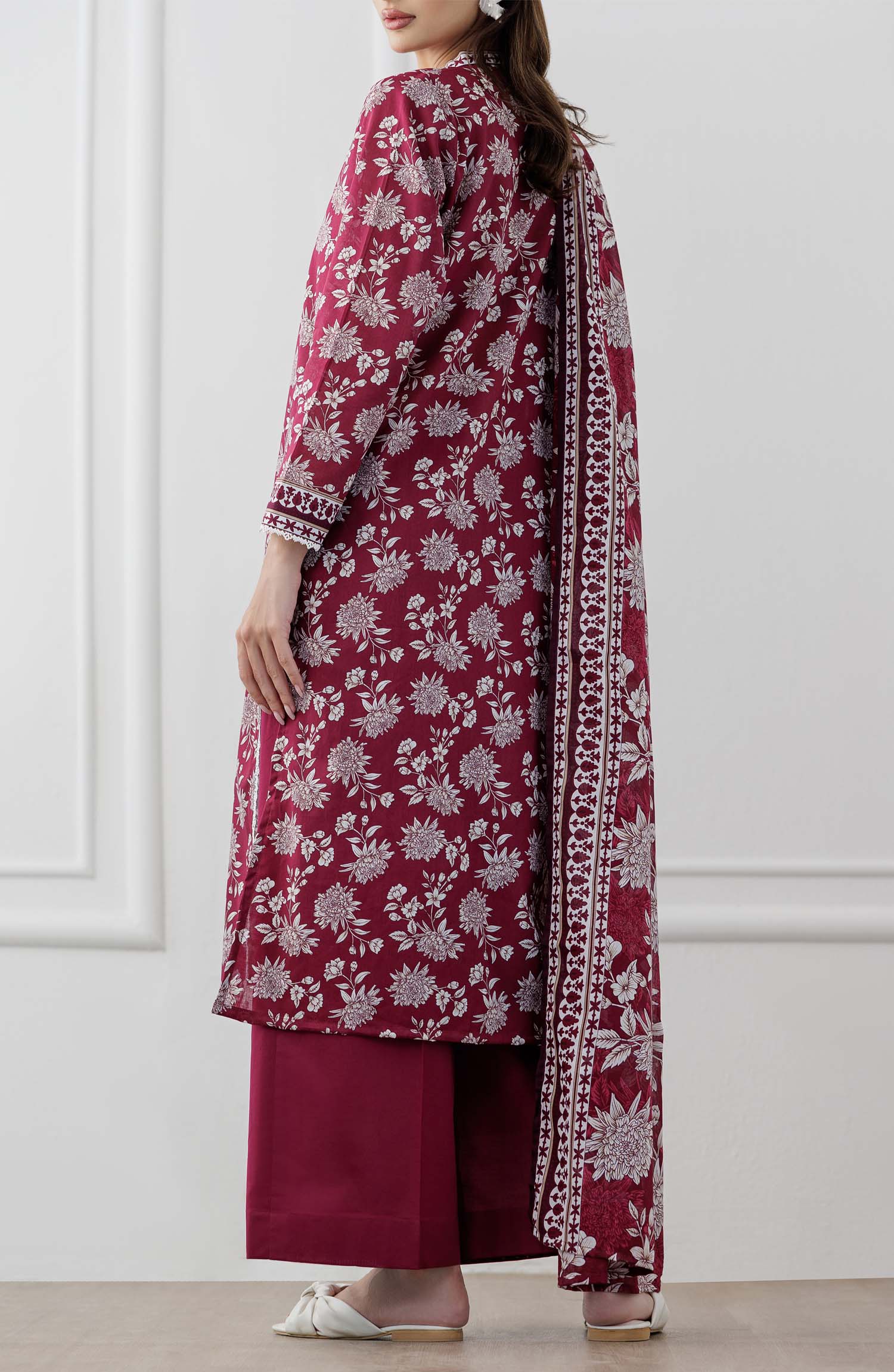 UNSTITCHED Printed Lawn Shirt Dupatta & Pant - 3 Piece Suits - OTL-25-060. Woman wearing a maroon floral dress with white patterns with printed dupatta on a plain trouser.