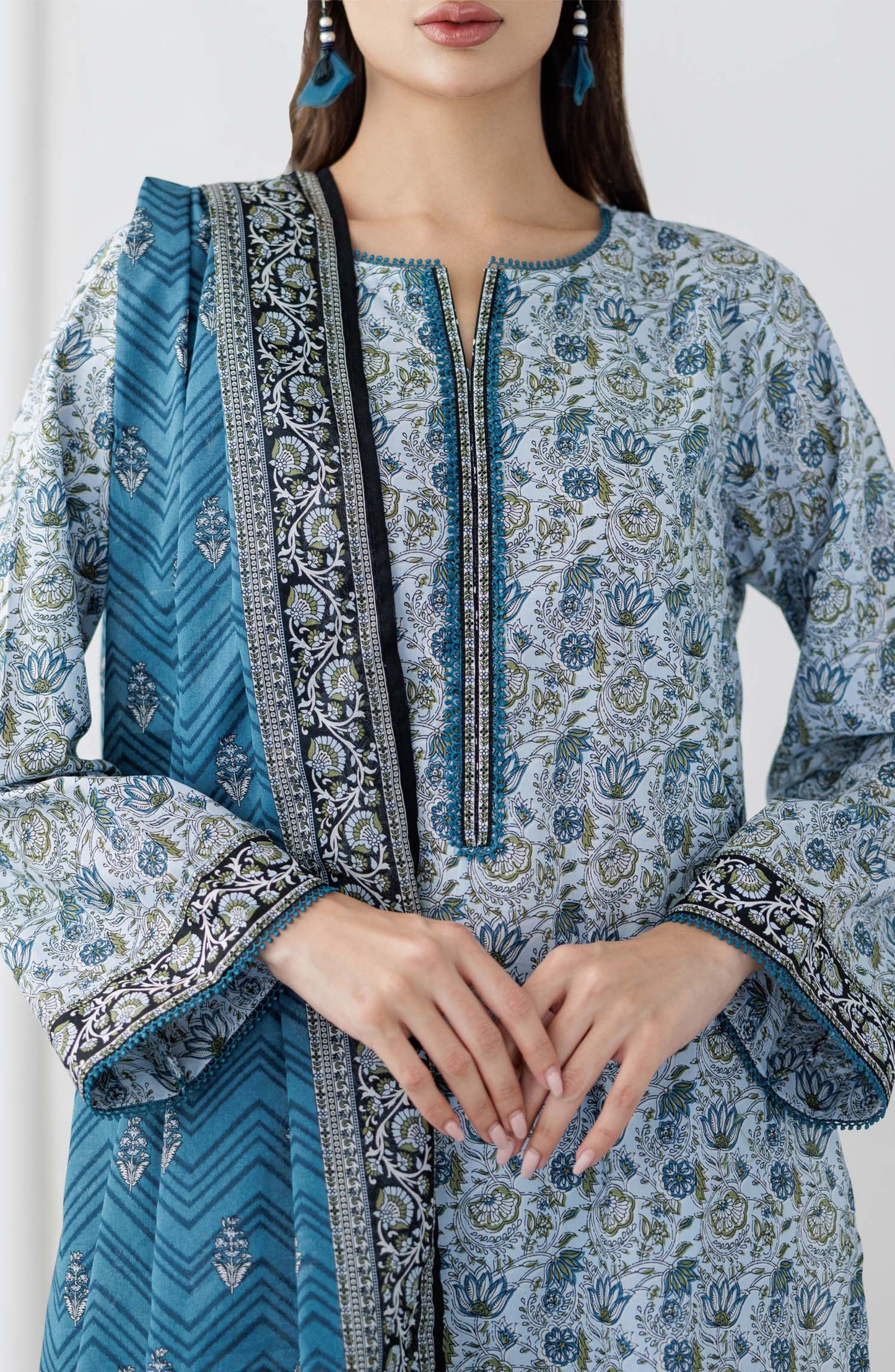 UNSTITCHED Printed Lawn Shirt Dupatta & Pant - 3 Piece Suits - OTL-25-347. Woman wearing a blue and white patterned kurta with a matching dupatta  and dyed trouser.